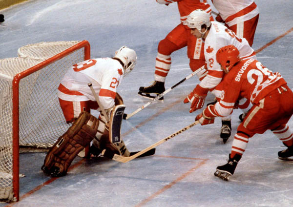 Canada's Paul Pageau (goalie) and Don Spring (8) compete in hockey action against the U.S.S.R. at the 1980 Winter Olympics in Lake Placid. (CP Photo/ COA)