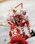 (Left to right) Canada's Ron Davidson, Paul Pageau and Terry O'Mally compete in hockey action against the U.S.S.R. at the 1980 Winter Olympics in Lake Placid. (CP Photo/ COA)