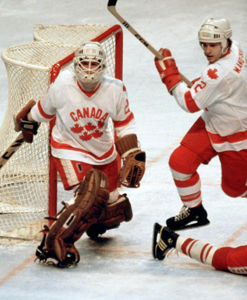 Canada's Paul Pageau (goalie) and Warren Anderson compete in hockey action against the U.S.S.R. at the 1980 Winter Olympics in Lake Placid. (CP Photo/ COA)