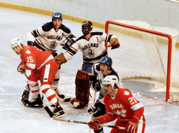 Canada's John Devaney (15) and Kevin Primeau (21) compete in hockey action against the Netherlands at the 1980 Winter Olympics in Lake Placid. (CP Photo/ COA)