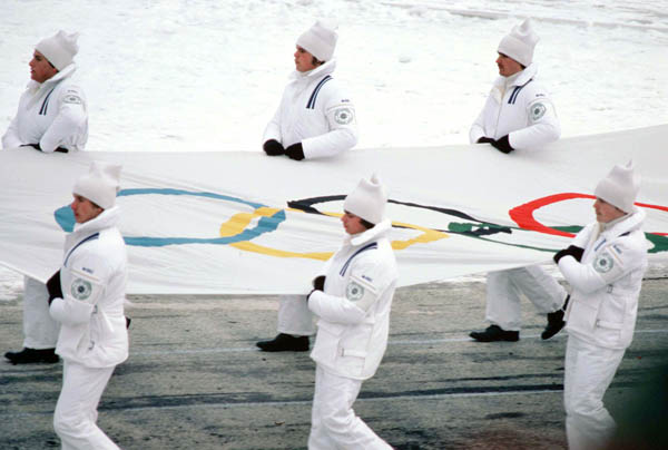 The Olympic flag is carried during the opening ceremonies of the 1980 Winter Olympics in Lake Placid. (CP PHOTO/COA)