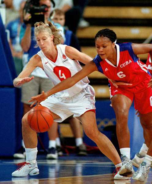 Canada's Michelle Hendry (left) reaches for the ball during basketball action at the Sydney 2000 Olympic Games. (CP PHOTO/ COA)