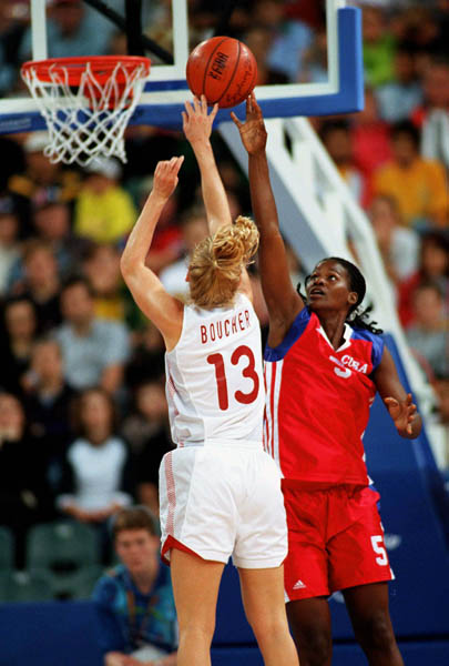 Canada's Kelly Boucher (#13) leaps to block a shot during basketball action at the Sydney 2000 Olympic Games. (CP PHOTO/ COA)