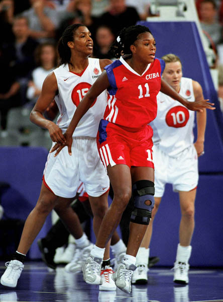 Canada's Tammy Sutton-Brown (15) and Stacey Dales (#10) participate in basketball action at the Sydney 2000 Olympic Games. (CP PHOTO/ COA)