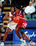 Canada's Tammy Sutton-Brown (15) jumps for a shot as teammate Dianne Norman (11) looks on during basketball action at the Sydney 2000 Olympic Games. (CP PHOTO/ COA)