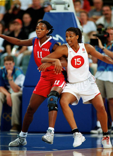 Canada's Tammy Sutton-Brown (15) puts on pressure during basketball action at the Sydney 2000 Olympic Games. (CP PHOTO/ COA)