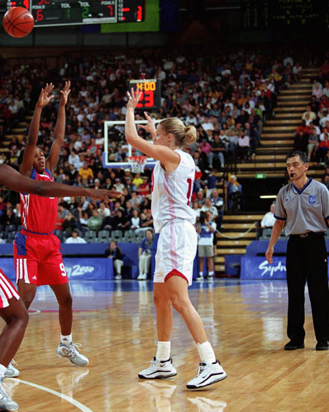 Canada's Stacey Dales (right) makes a pass during basketball action at the Sydney 2000 Olympic Games. (CP PHOTO/ COA)