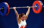 Canada's Maryse Turcotte celebrates after a lift in the women's 58 kg weightlifting competition at the Sydney Olympic Games on  Monday September 18, 2000.  (CP Photo/COA)