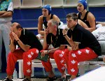 Canadian women's waterpolo team coach Daniel Berthelette (right) gives instructions during preliminary action against Australia at the 2000  Sydney Olympic Games. (CP Photo/COA)