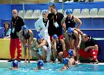 Canadian women's waterpolo team coach Daniel Berthelette (right) gives instructions during preliminary action against Australia at the 2000  Sydney Olympic Games. (CP Photo/COA)