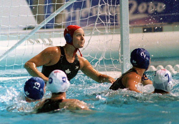 Canada's netminder Josee Marsolais keeps her eyes on the ball during women's waterpolo preliminary action at the 2000 Sydney Olympic Games. (CP Photo/COA)