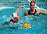 Canada's Sandra Lize (left) participates in women's waterpolo preliminary action at the 2000 Sydney Olympic Games. (CP Photo/COA)