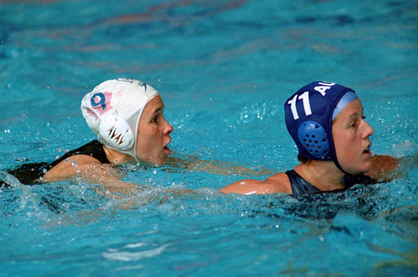 Canada's Ann Dow (left) participates in women's waterpolo preliminary action at the 2000 Sydney Olympic Games. (CP Photo/COA)