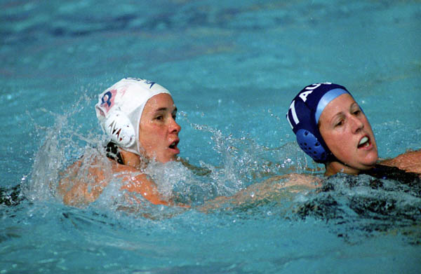 Canada's Ann Dow (left) participates in women's waterpolo preliminary action at the 2000 Sydney Olympic Games. (CP Photo/COA)