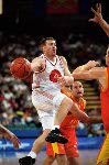 Canada's David Daniels (left) makes a pass during basketball action at the 2000 Sydney Olympic Games. (CP Photo/ COA)