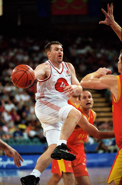 Canada's David Daniels (4) jumps for a shot during basketball action at the 2000 Sydney Olympic Games. (CP Photo/ COA)