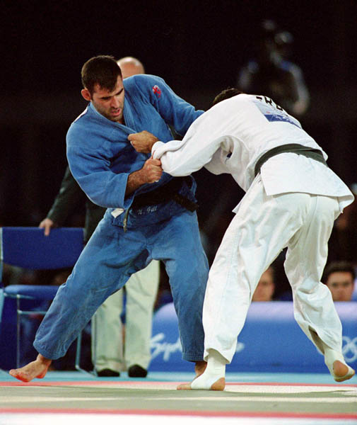Canada's Nicolas Gill (left) competes in the judo event of the 2000 Sydney Olympic Games. (CP Photo/ COA)
