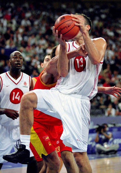 Canada's Pete Guarasci (13) and Michael Meeks (14) participate in basketball action at the 2000 Sydney Olympic Games. (CP Photo/ COA)