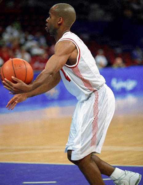 Canada's Greg Francis handles the ball during basketball action at the 2000 Sydney Olympic Games. (CP Photo/ COA)