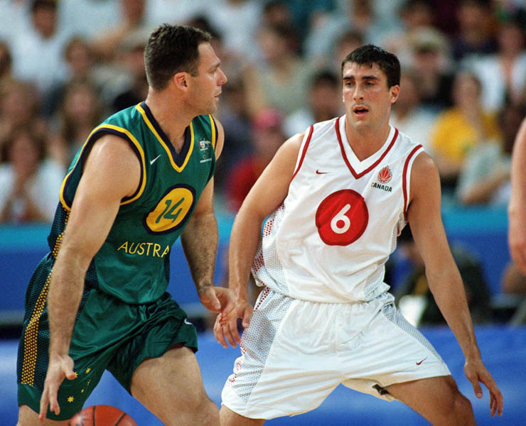 Canada's Andrew Mavis (right) plays basketball at the 2000 Sydney Olympic Games. (CP Photo/ COA)