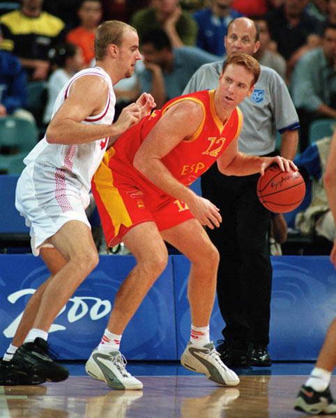 Canada's Greg Newton (left) participates in basketball action at the 2000 Sydney Olympic Games. (CP Photo/ COA)