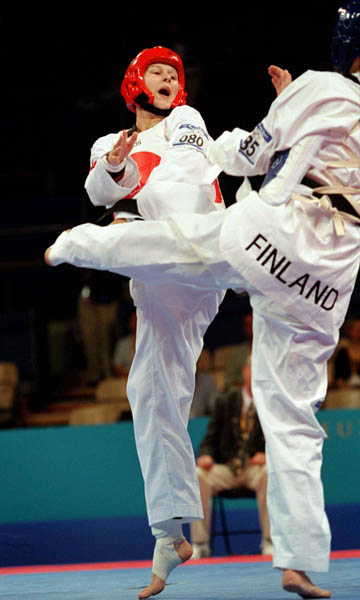 Canada's Dominique Bosshart (left) competes in the Taekwondo event of the 2000 Sydney Olympic Games. (CP PHOTO/ COA)