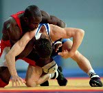 Canada's Daniel Igali competes in the wrestling event at the 2000 Sydney Olympic Games. (CP Photo/ COA)