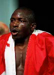 Canada's Daniel Igali celebrates his gold medal win in the wrestling event at the 2000 Sydney Olympic Games. (CP PHOTO/ COA)