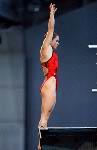 Anouk Reniere-Lafreniere flips through the air during the Canadian syncronized swiming team's practice during the Athens 2004 Summer Olympic Games on Tuesday Aug. 10 2004. (CP PHOTO 2004/Andre Forget/COC)