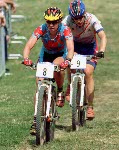 Canada's Chrissy Redden (8) and Alison Sydor (2) compete in a cross country cycling race at the 2000 Sydney Olympic Games. (CP PHOTO/ COA)