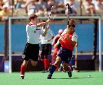 Canada's Scott Mosher (10) and Andrew Griffiths (centre) play field hockey at the 2000 Sydney Olympic Games. (CP Photo/ COA)