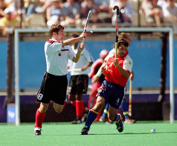 Canada's Andrew Griffiths (8) plays field hockey at the 2000 Sydney Olympic Games. (CP Photo/ COA)