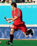 Canada's Scott Mosher (10) and Andrew Griffiths (centre) play field hockey at the 2000 Sydney Olympic Games. (CP Photo/ COA)