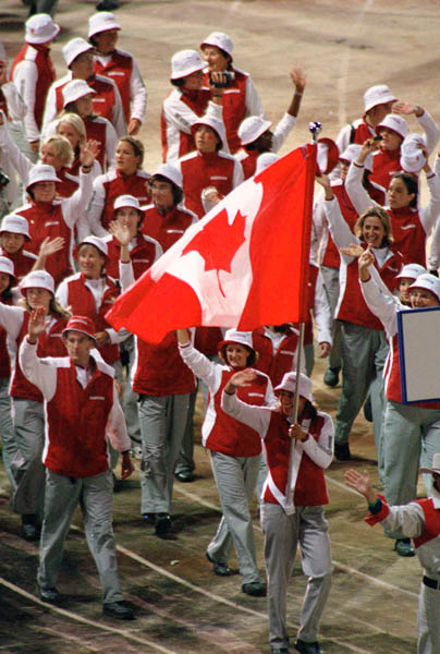 Canada's Caroline Brunet carries the Canadian flag during the opening ceremonies at the 2000 Sydney Olympic Games. (CP PHOTO/ COA)
