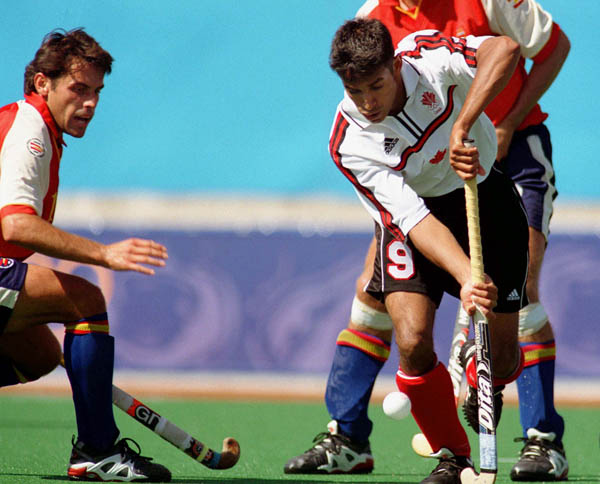 Canada's Ken Pereira (9) plays field hockey at the 2000 Sydney Olympic Games. (CP Photo/ COA)