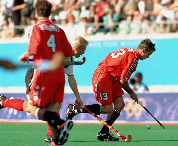 Canada's Alan Brahmst (4) and Rob Short (13) play field hockey at the 2000 Sydney Olympic Games. (CP Photo/ COA)
