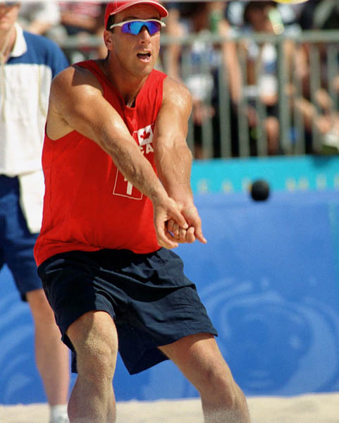 Canada's John Child (1) plays a set of beach volleyball at the 2000 Sydney Olympic Games. (CP Photo/ COA)