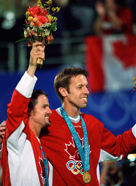 Canada's Daniel Nestor (right) and Sebastien Lareau celebrate after winning gold in men's doubles tennis action at the 2000 Sydney Olympic Games. (Mike Ridewood/CP Photo/ COA)