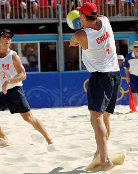 Canada's John Child (1) and Mark Heese (2) play a set of beach volleyball at the 2000 Sydney Olympic Games. (CP Photo/ COA)