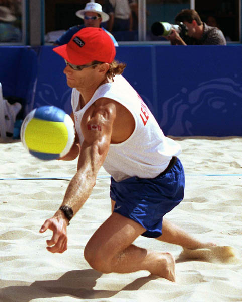 Canada's Conrad Leinemann competes in the beach volleyball event at the Sydney 2000 Olympic Games. (CP PHOTO/ COA)