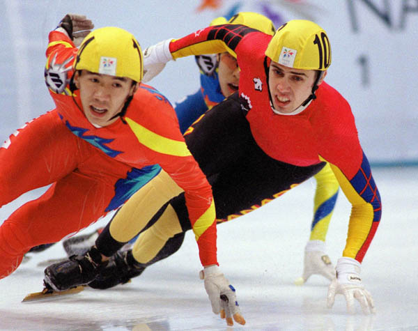 Canada's Eric Bedard (right) competes in the short track speed skating event at the 1998 Nagano Winter Olympic Games. (CP Photo/ COA/ Scott Grant)