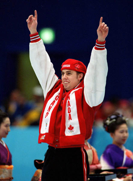Canada's Eric Bedard celebrates after winning the bronze medal in the short track speed skating event at the 1998 Nagano Olympic Games. (CP Photo/ COA)