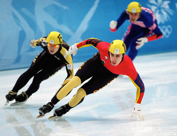 Canada's Eric Bedard (centre) competes in the short track speed skating event at the 1998 Nagano Winter Olympic Games. (CP Photo/ COA/ Scott Grant)
