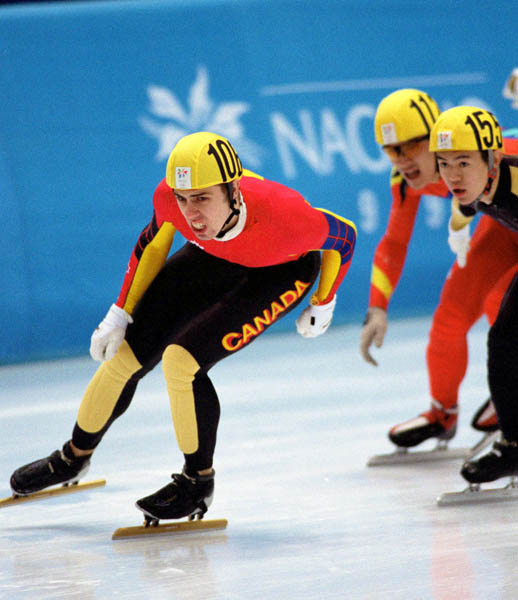 Canada's Eric Bedard (left) competes in the short track speed skating event at the 1998 Nagano Winter Olympic Games. (CP Photo/ COA/ Scott Grant)