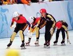 Canada's Isabelle Charest (8) and Annie Perreault (7) compete in a short track speed skating event at the 1998 Nagano Winter Olympic Games. (CP Photo/ COA/ Scott Grant)