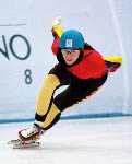 Canada's Isabelle Charest (8) and Annie Perreault (7) compete in a short track speed skating event at the 1998 Nagano Winter Olympic Games. (CP Photo/ COA/ Scott Grant)