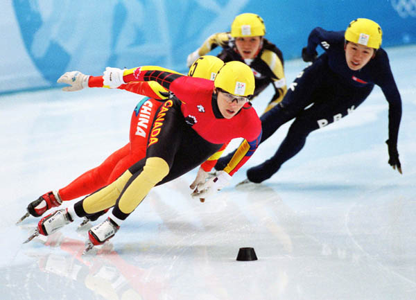 Canada's Isabelle Charest (foreground)competes in the short track speed skating event at the 1998 Nagano Winter Olympic Games. (CP Photo/ COA/ Scott Grant)
