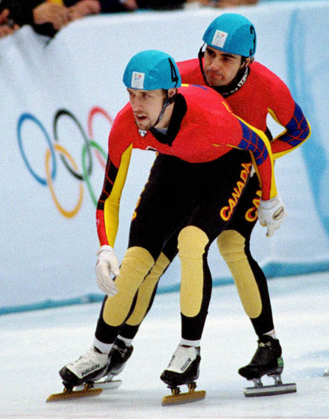 Canada's Marc Gagnon (4) and Francois Drolet (3) compete in the short track relay speed skating event at the 1998 Nagano Winter Olympic Games. (CP Photo/ COA/ Scott Grant)