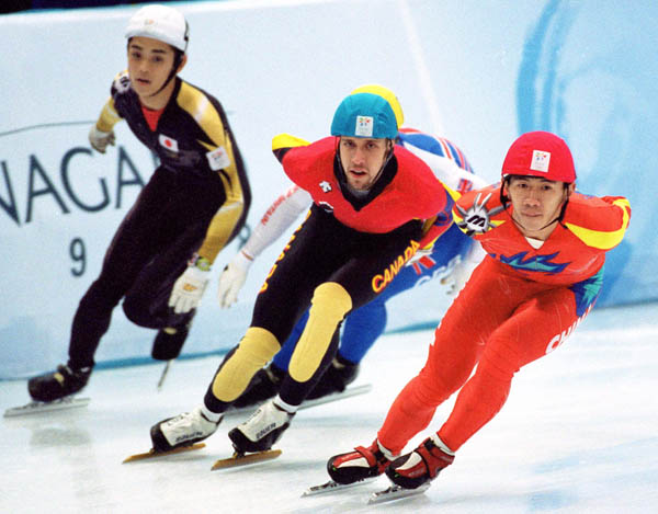 Canada's Marc Gagnon (centre) competes in the short track speed skating event at the 1998 Nagano Winter Olympic Games. (CP Photo/ COA/ Scott Grant)