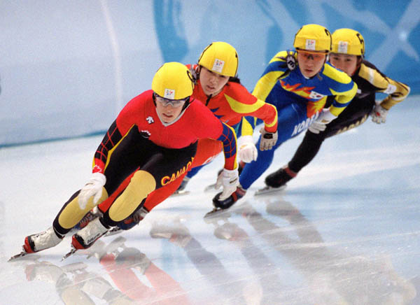 Canada's Annie Perreault (front) competes in the short track speed skating event at the 1998 Nagano Winter Olympic Games. (CP Photo/ COA/ Scott Grant)